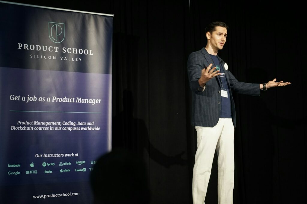 A soft skills trainer standing on stage